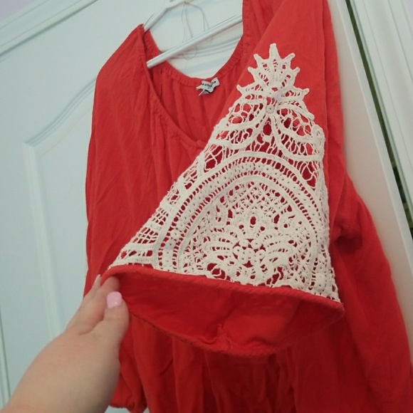 Orange top with crochet degin on arm - Picture 2 of 2